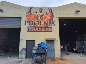 print on wall, Phoenix Trailers logo for workshop
